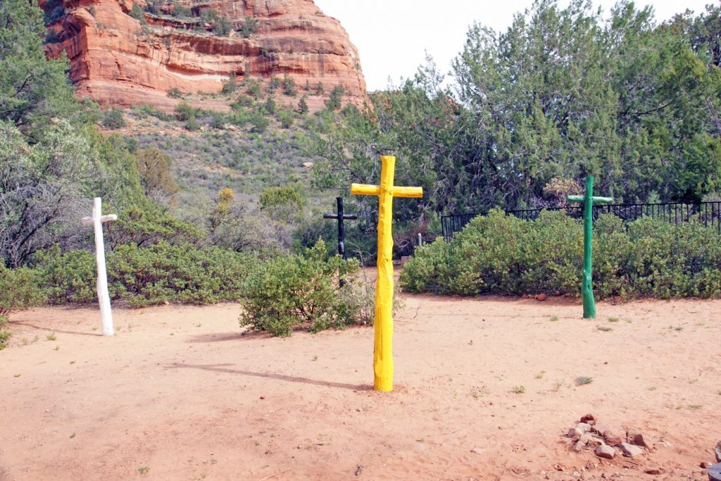 Four crosses on a trail.