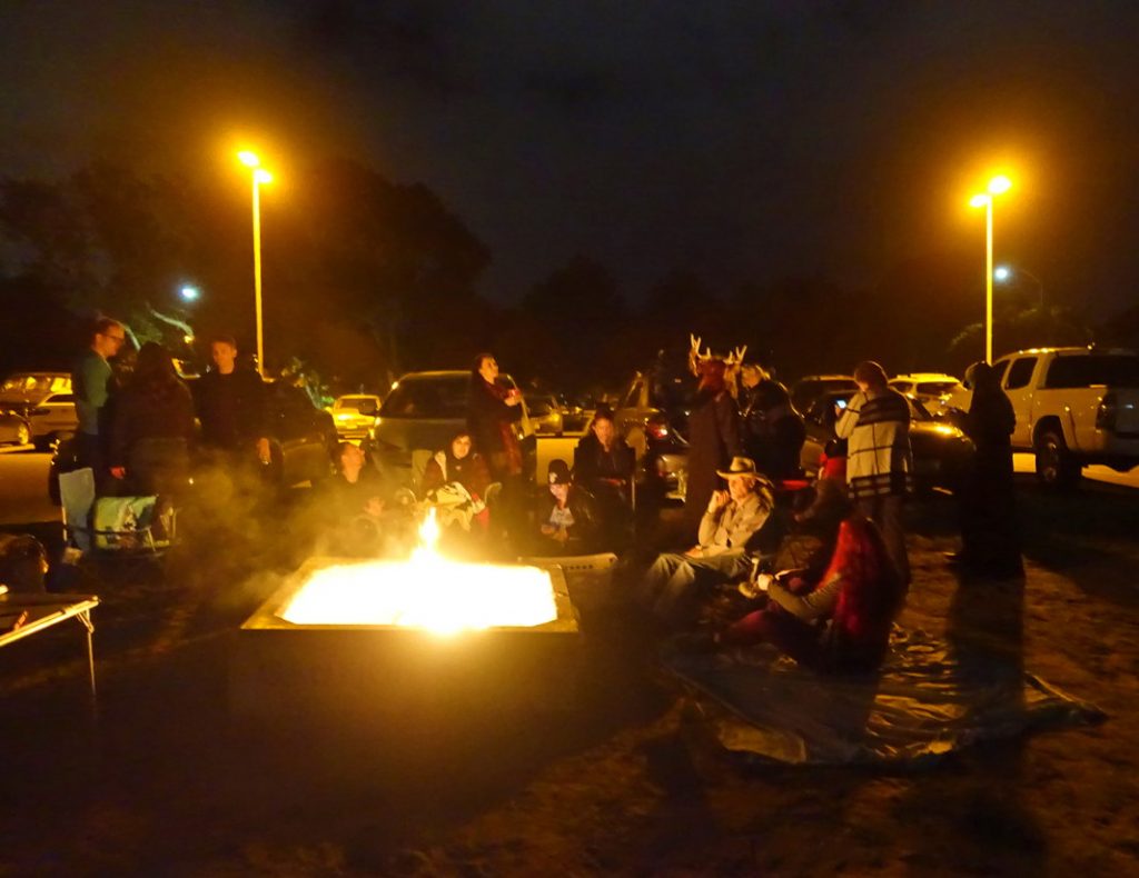 Stay warm at a beach bonfire.