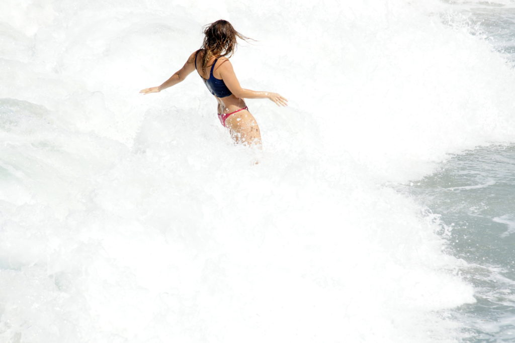 Surfers in the mist.