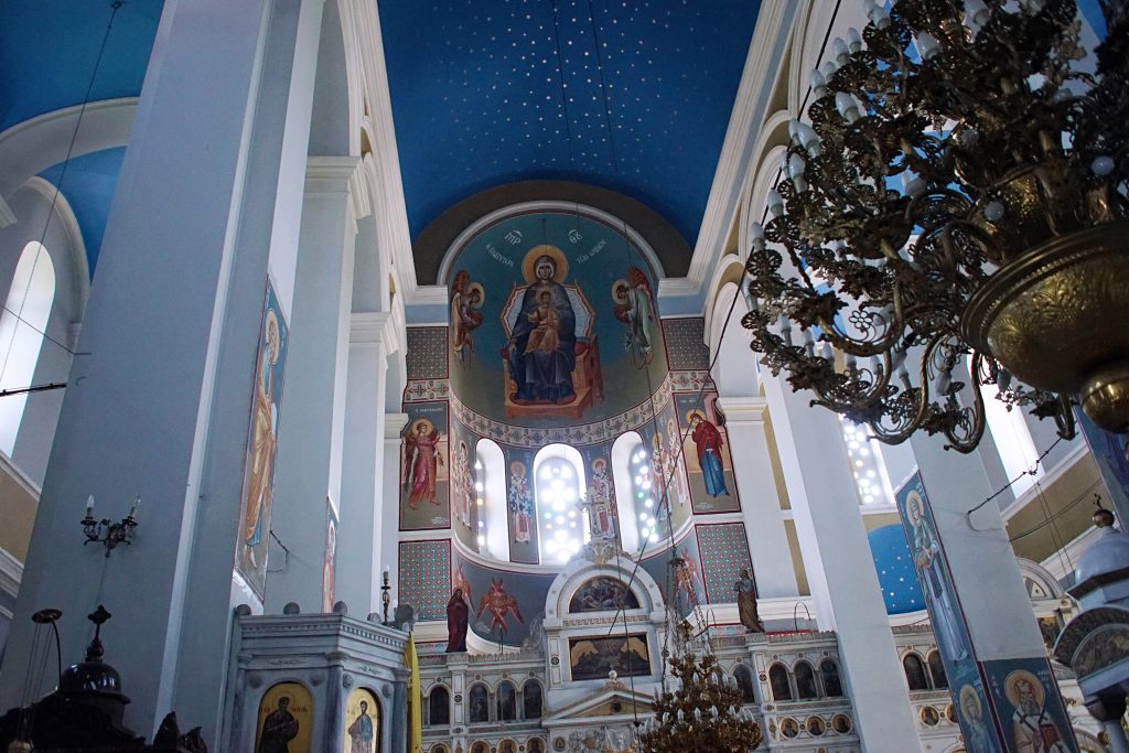 The artwork above the altar depicts the Catholic god and his mother.