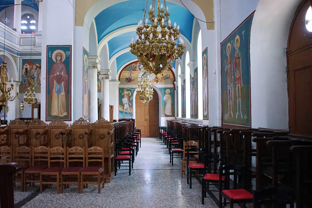 The nave and aisles are lighted by natural light and by golden chandeliers.