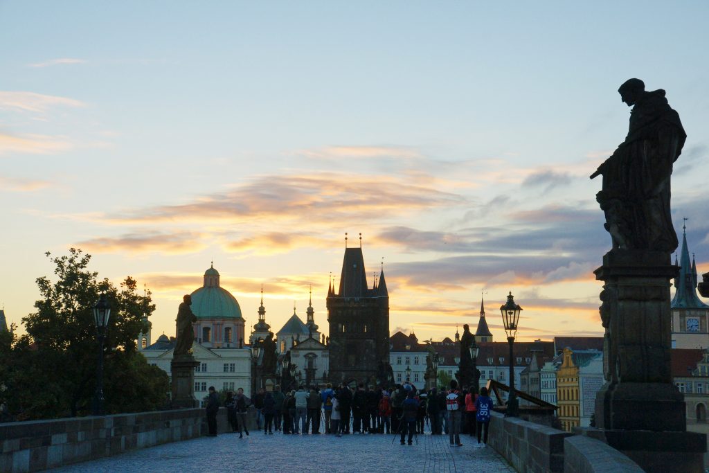 A wall of people spans the bridge.