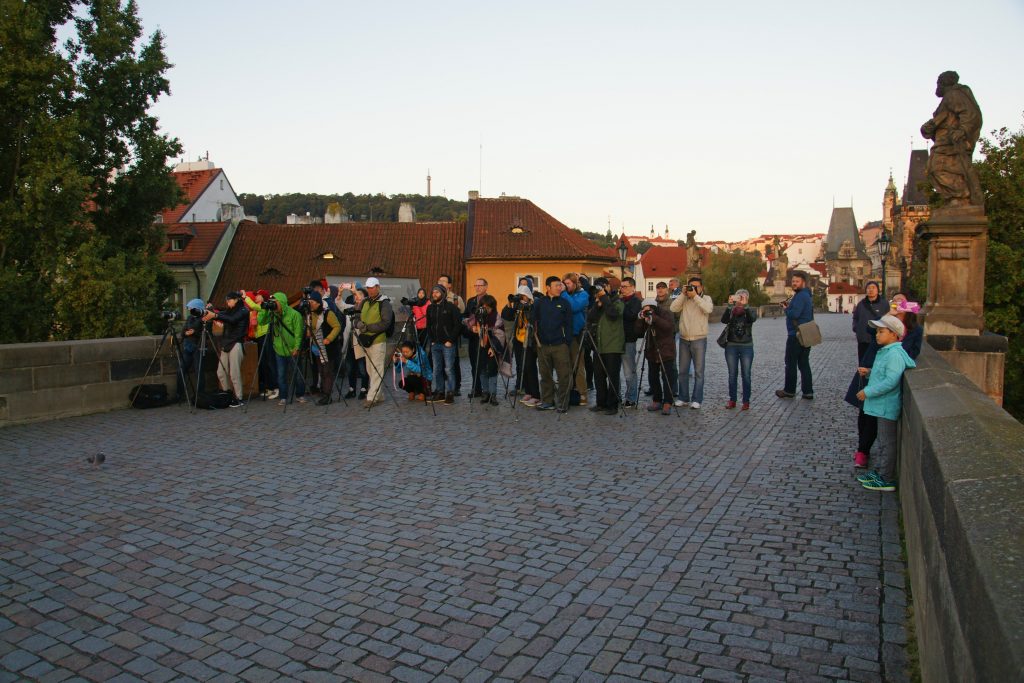 A mob of photographers awaits the sunrise.