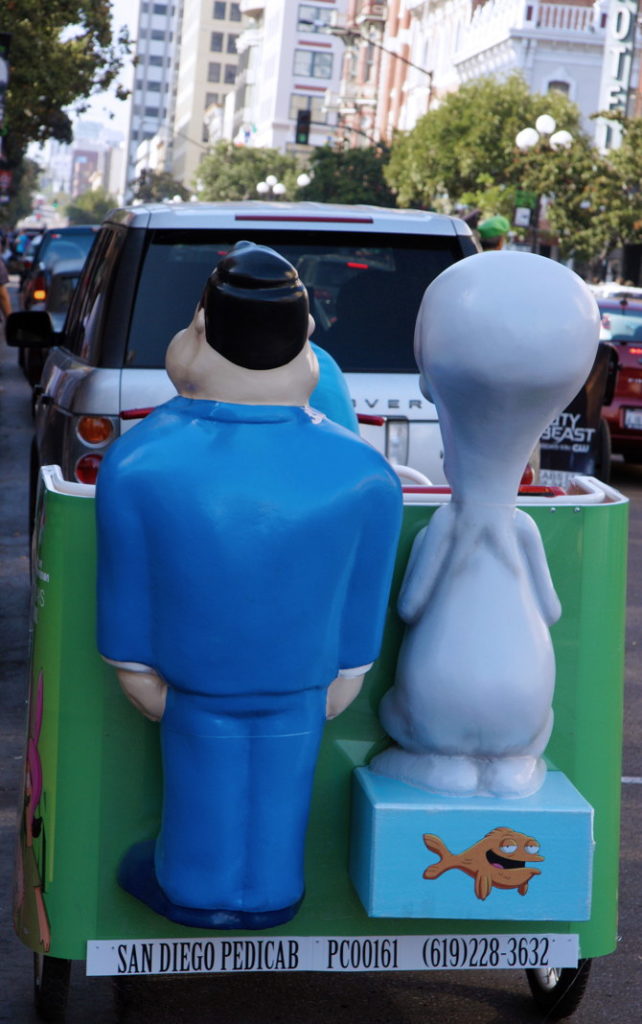 Stan, Roger, and Klaus ride a pedicab, the modern way to see San Diego downtown.