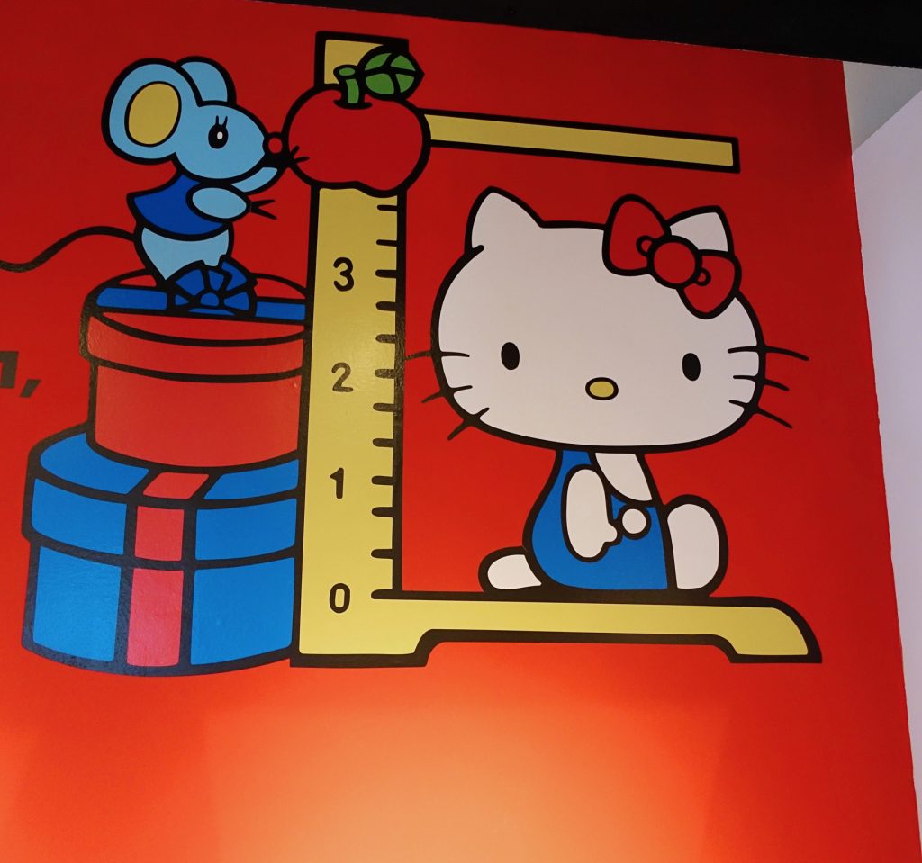 If Hello Kitty were standing, she'd be five apples.