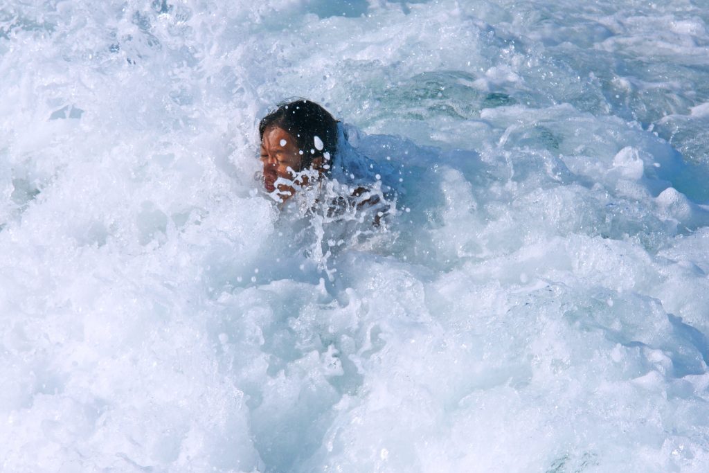 An oceanic bubble bath soothes the weary swimmer.