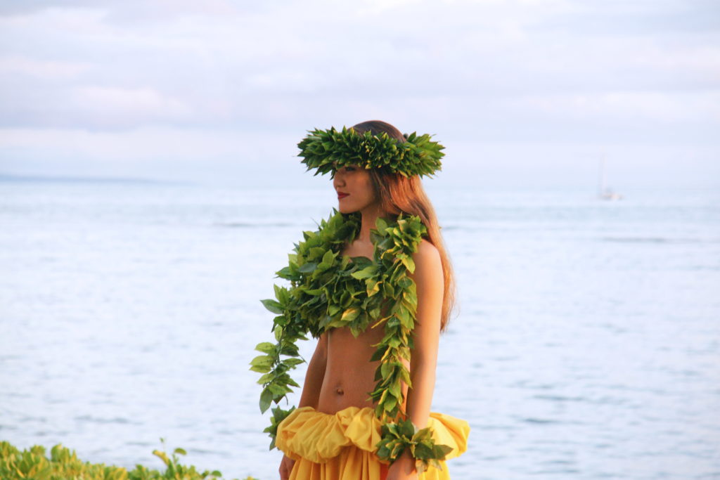 A dancer framed by the ocean and sky.