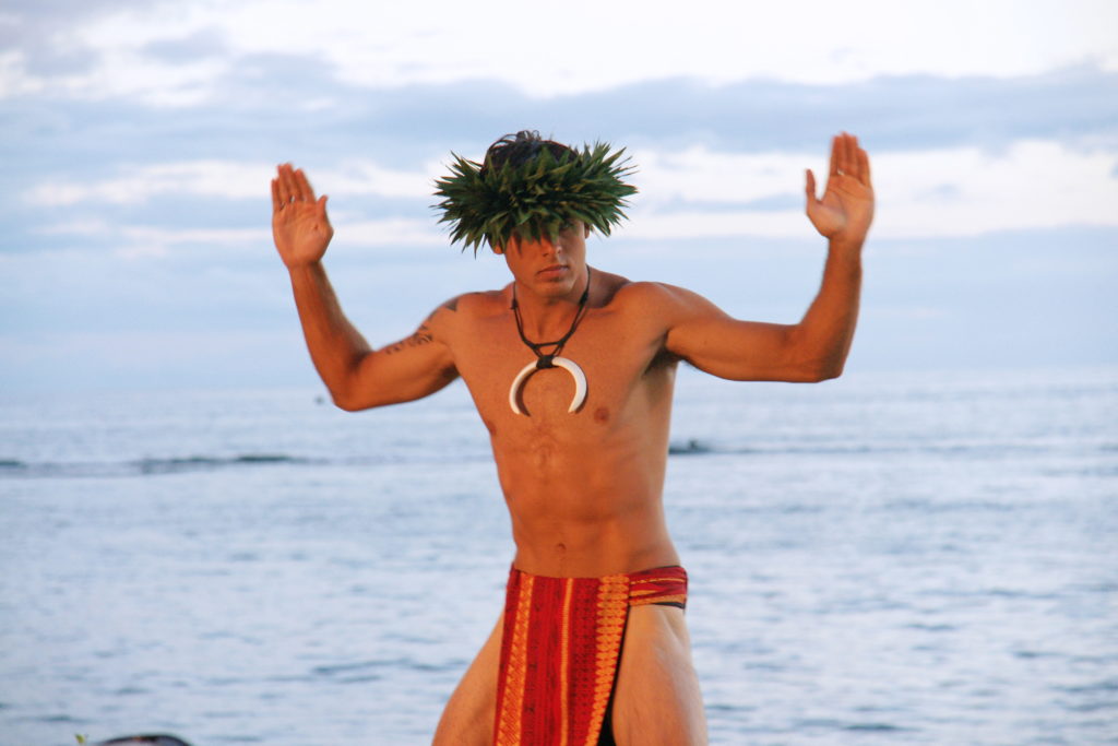 A dancer performs traditional Hawaiian dances.