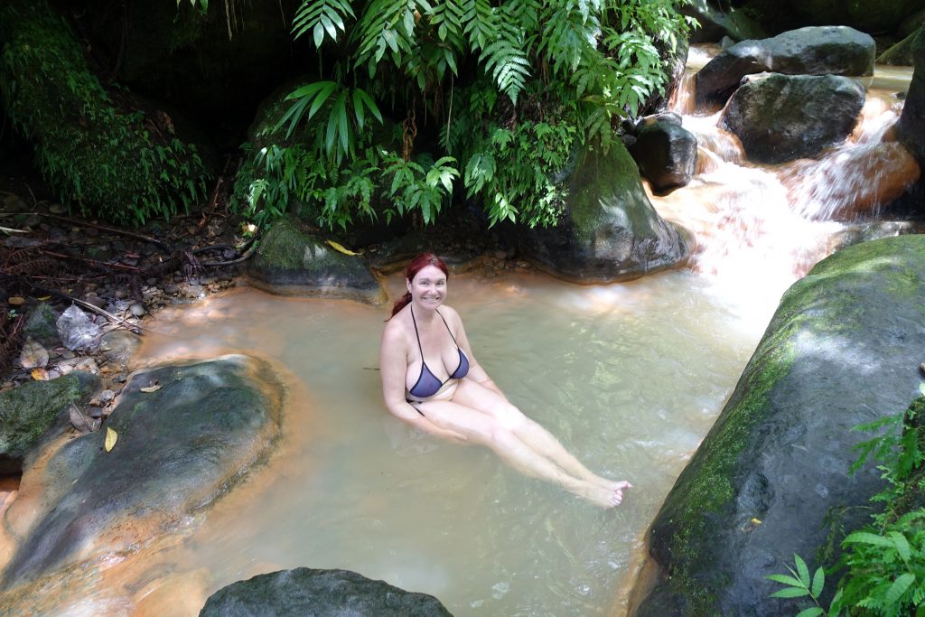 Relaxing in a pool of volcano-heated water.