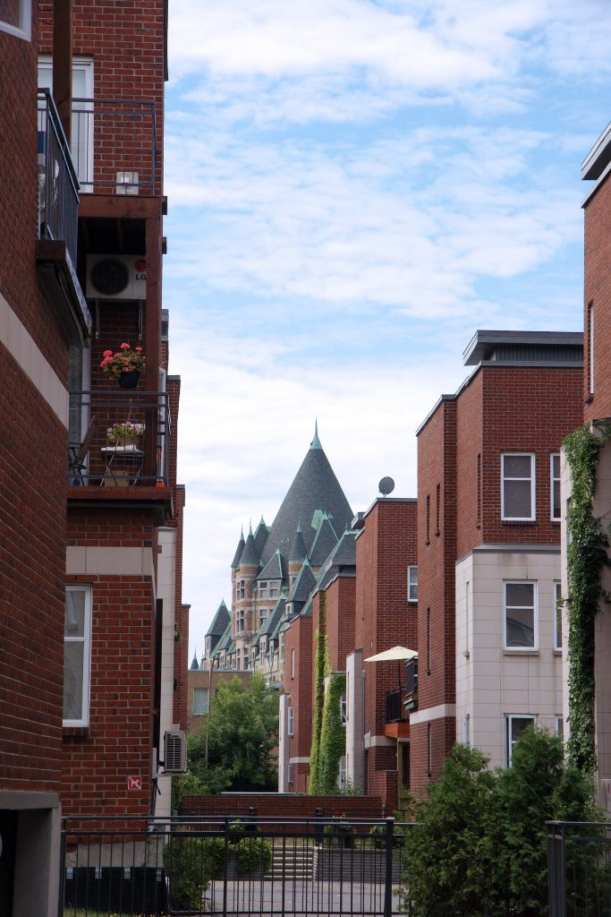 Pointy roofs mixed in with flat roofs.