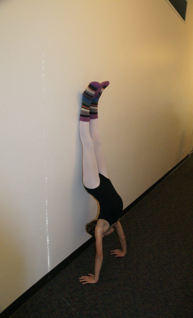 Nothing like a handstand to get a dancer warmed-up.