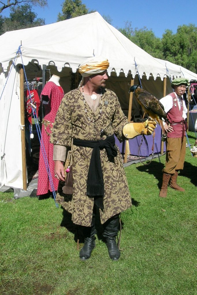 A falconer and his falcon pose for us.