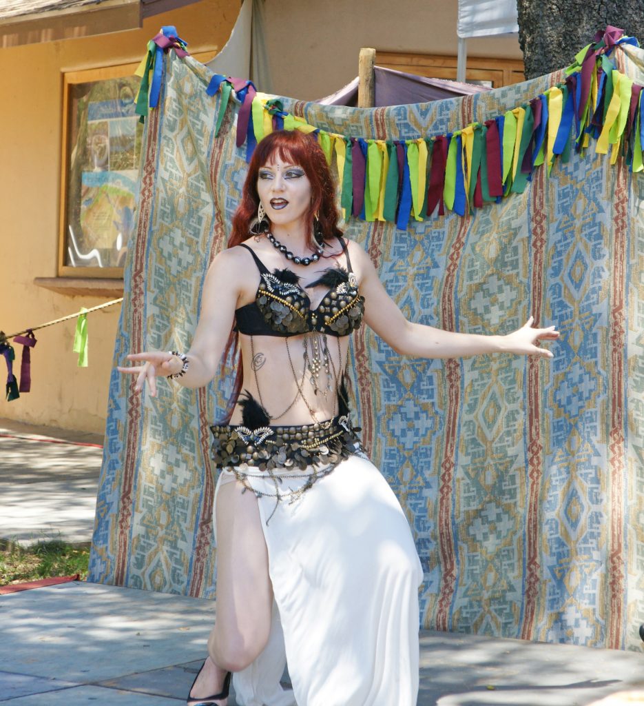 A tribal belly dancer dances tribally.