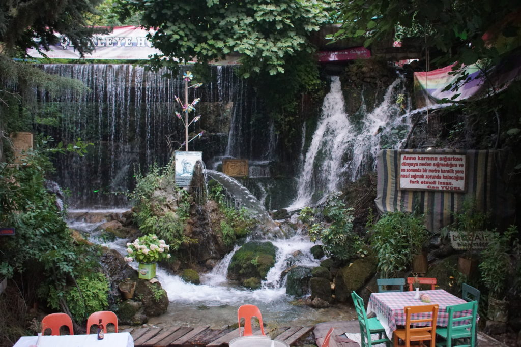 This corner of the restaurant has waterfalls cascading on the rocks.