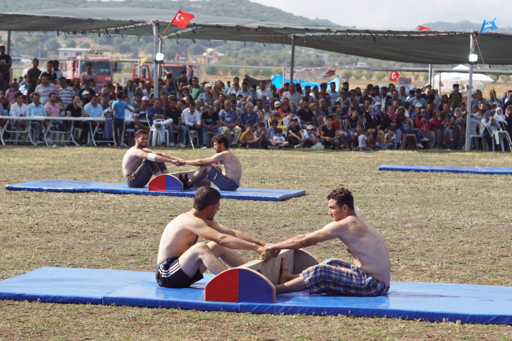 A two-man tug-of-war is about to commence.