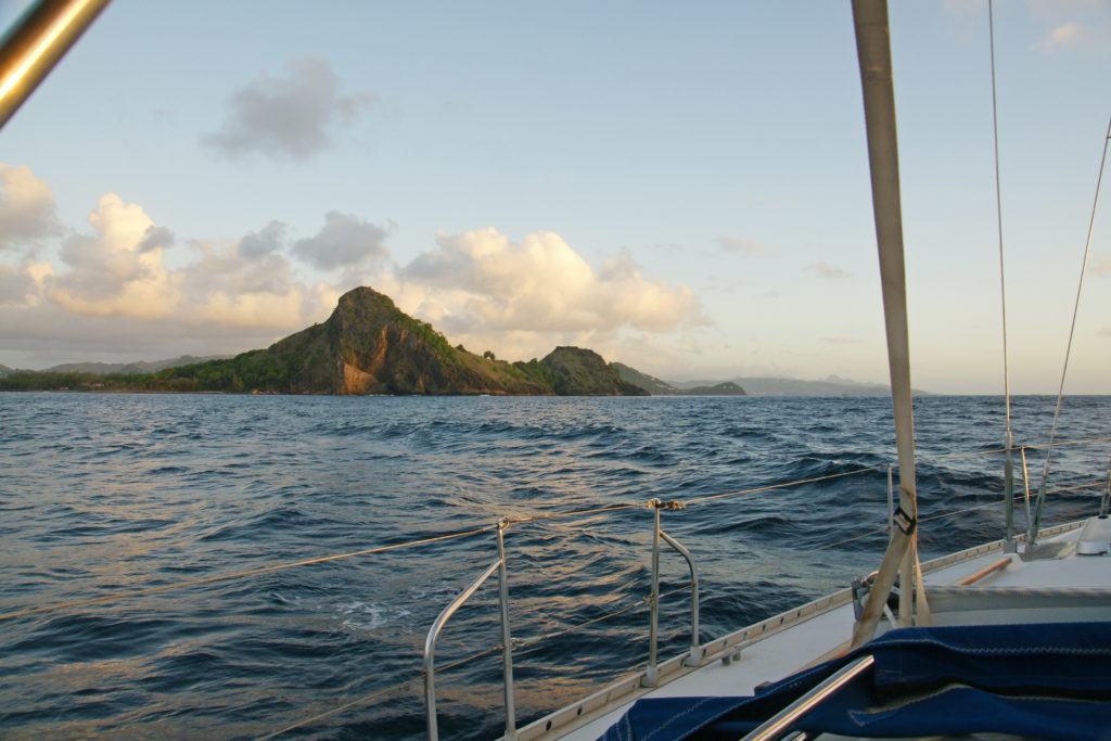 The setting sun casts shadows across the island.