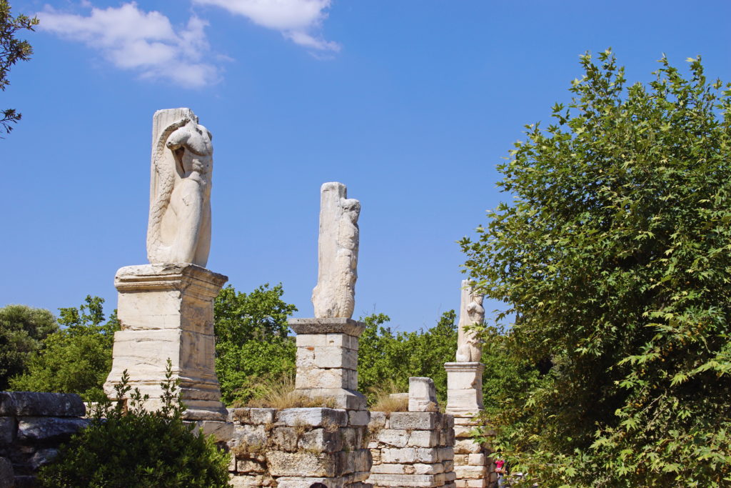 The statues of the Odeon of Agrippa greet us.