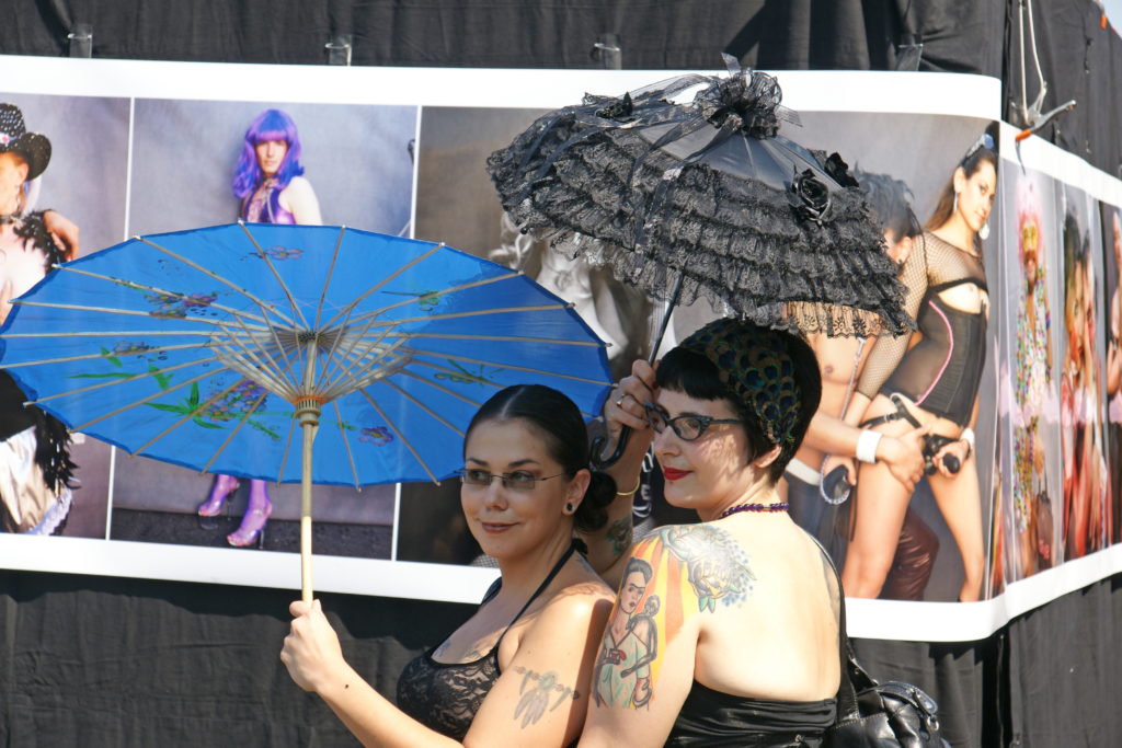 Two ladies protecting their delicate complexions.