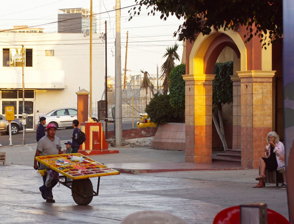 A street vendor vends on the street.