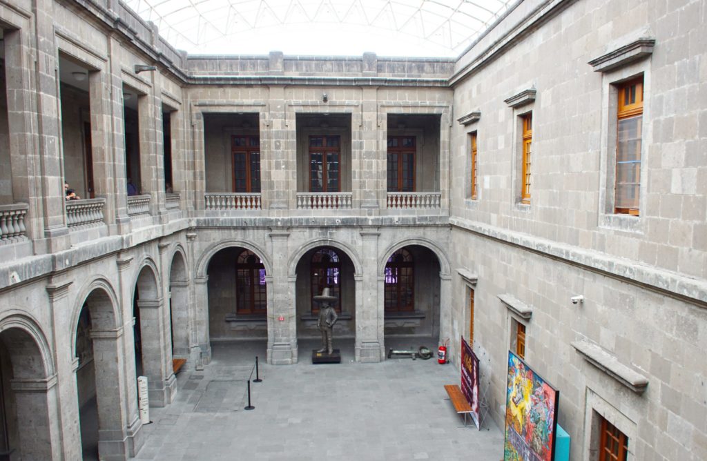 The inner courtyard, with a fire extinguisher and a thing on the ground.