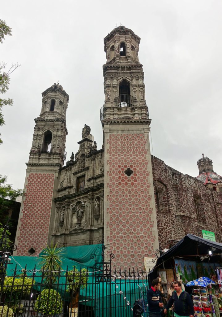 Vendors greet church goers AND provide temporary shelter from the rain.