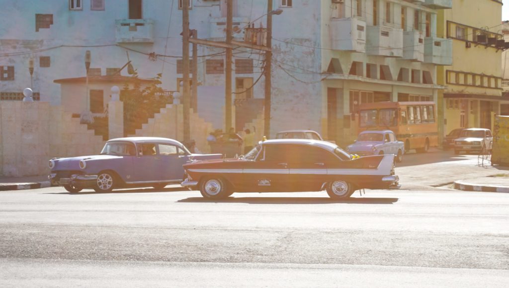 An old-timey photograph of old-timey cars.