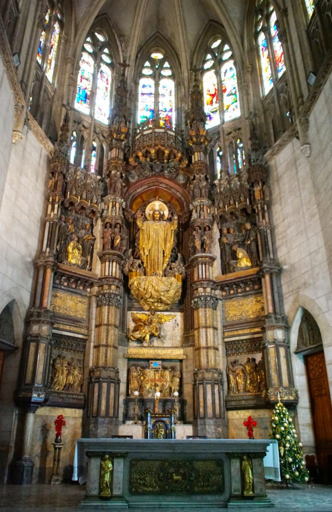 Golden Jesus watches us from a giant nugget of gold.