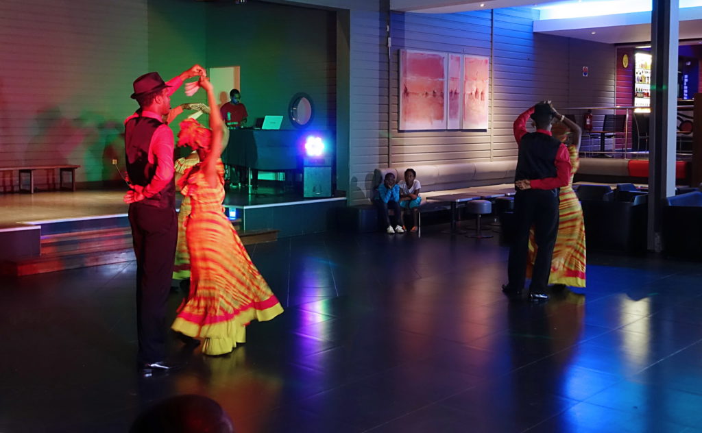 A couple of dancers dance as couples.