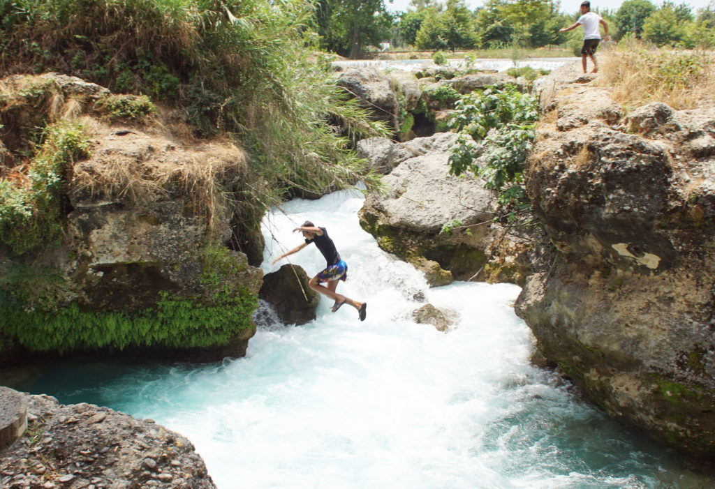 He was trying to jump across the river.