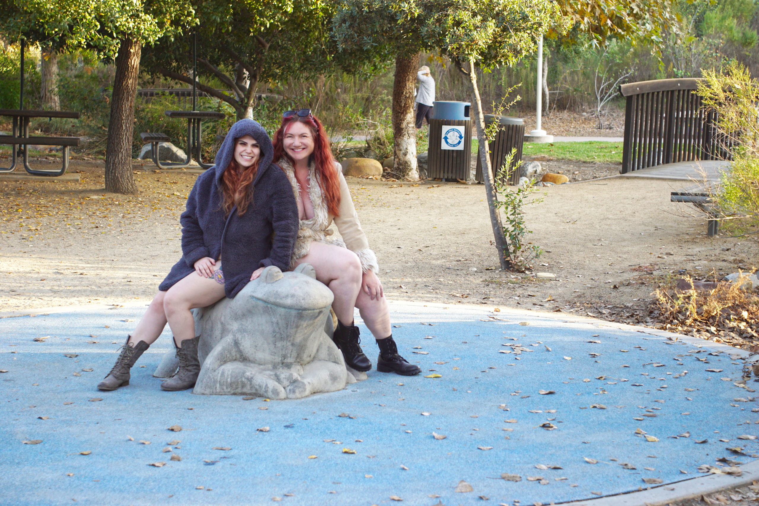 Posing on a frog.  So cute!
