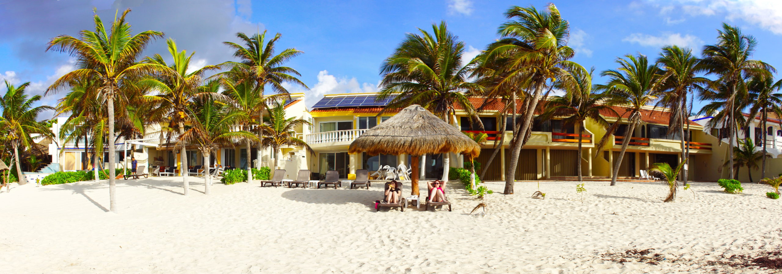 Relaxing in front of our house on the beach.