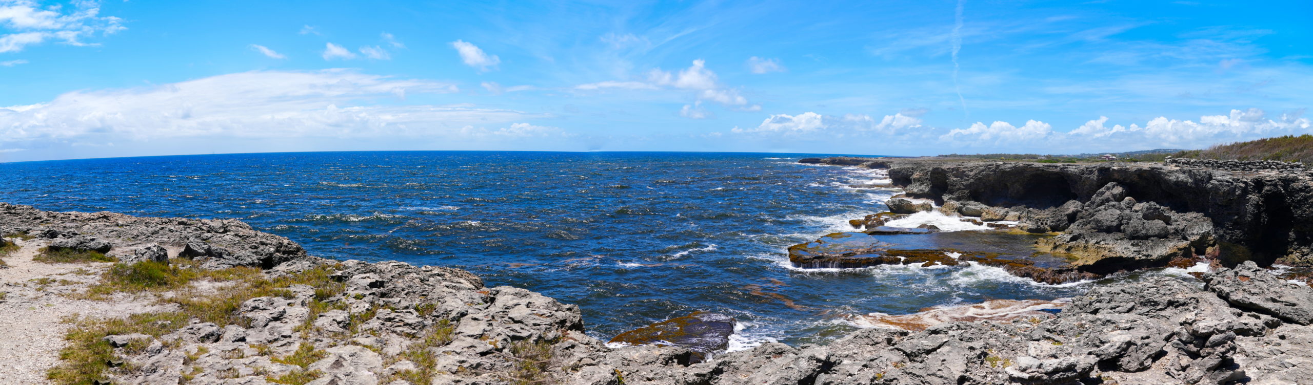 A panorama showing both the ocean and the sea.