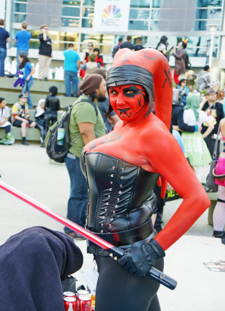 The lightsaber matches her skin. Nice.