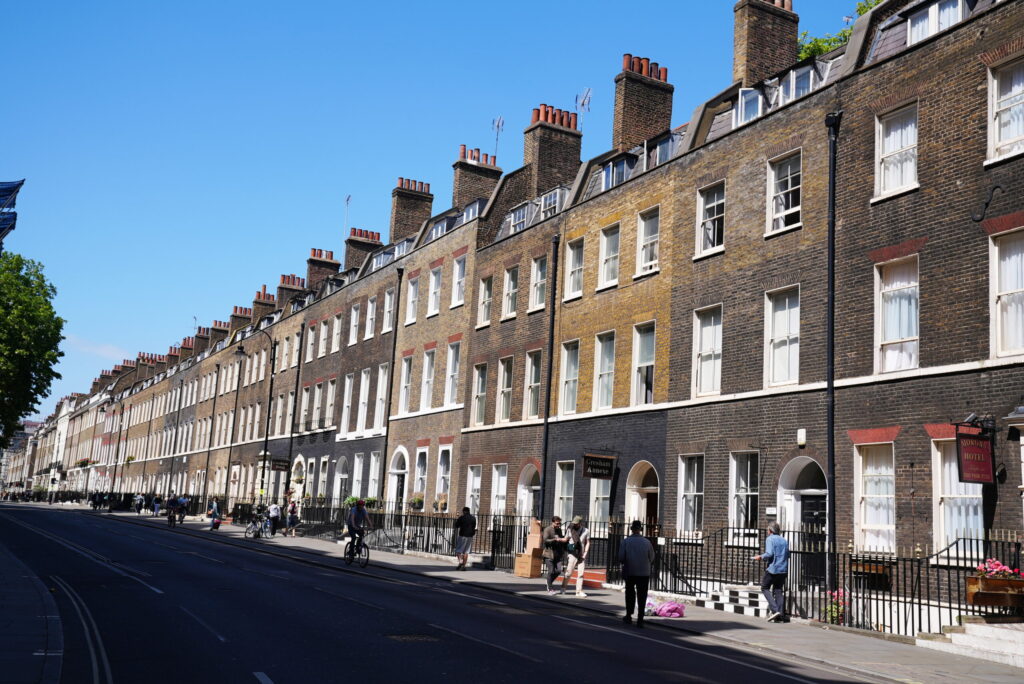 "I live in the brown building with rectangular windows. You can't miss it."