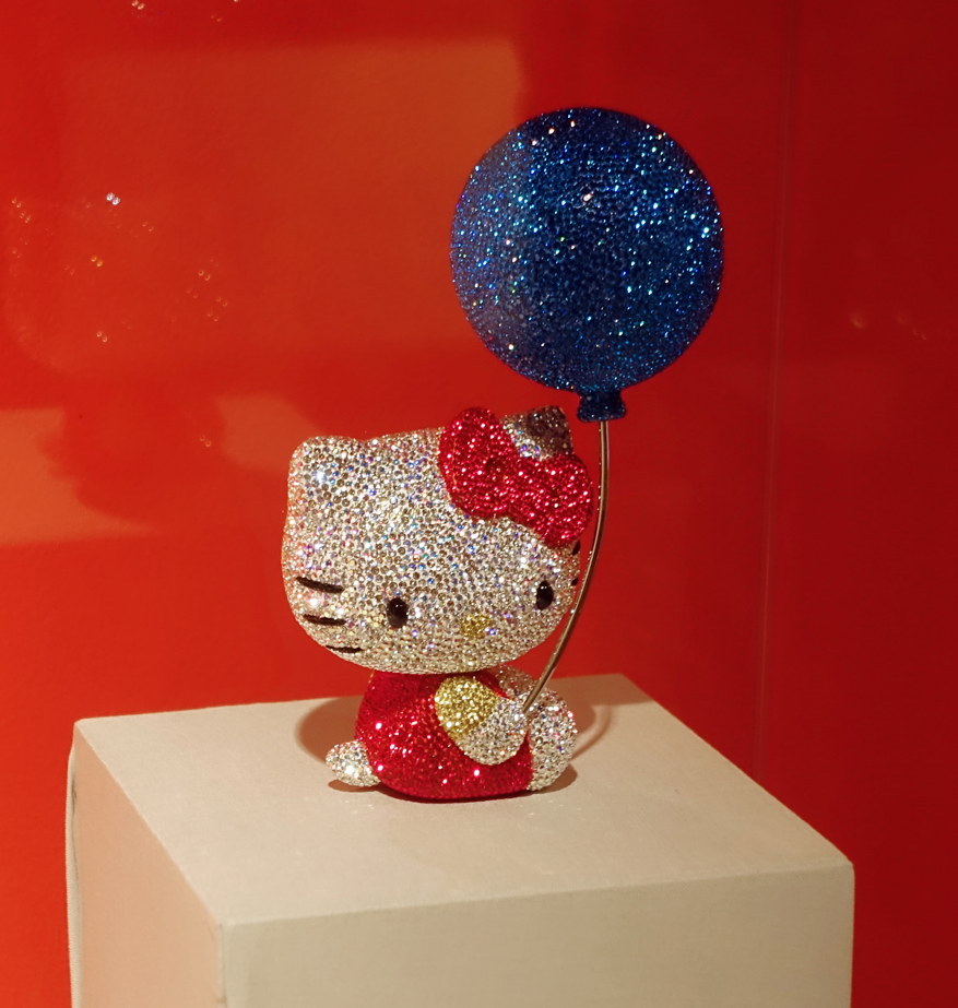 Jewel-encrusted Hello Kitty has a jewel-encrusted balloon.